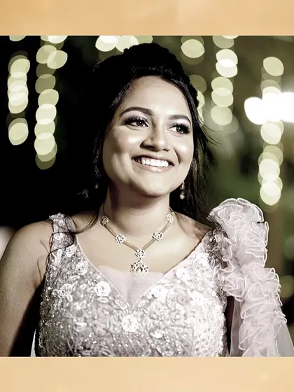 Another joyful shot of the bride at her reception. The bokeh background adds a magical touch to her already stunning look.