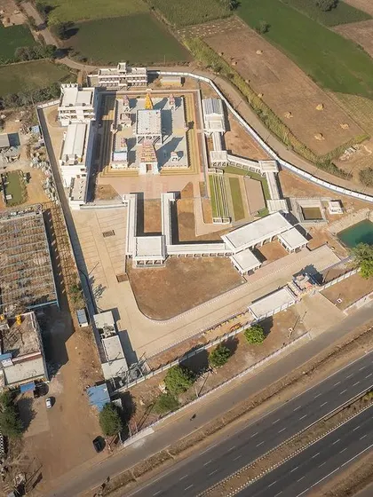 This birds-eye view illustrates the complete master plan for the Shiva Temple, showcasing the circulation strategy from the highway entrance to the inner sanctum.