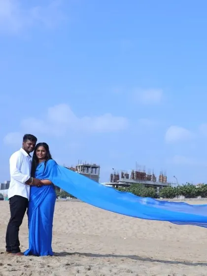 A beautiful beach day. The long trail of the blue flying saree looks incredible as it stretches out along the sand.