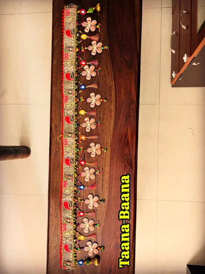 A complete view of the 'Taana Baana' toran. This piece is pure handmade joy, designed to make your doorway a conversation starter.