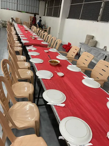 A simple Dastarkhwan setup with plastic chairs. This shows our ability to provide catering services for all types of events and budgets.