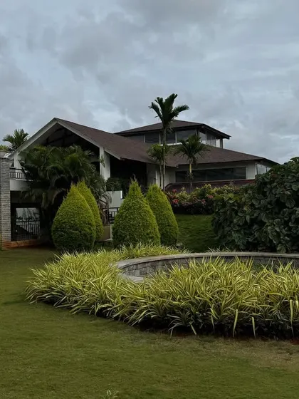 The main building and gardens on a cloudy day. The soft, diffused light creates a tranquil mood, perfect for the inward-focused work of a de-stress program.