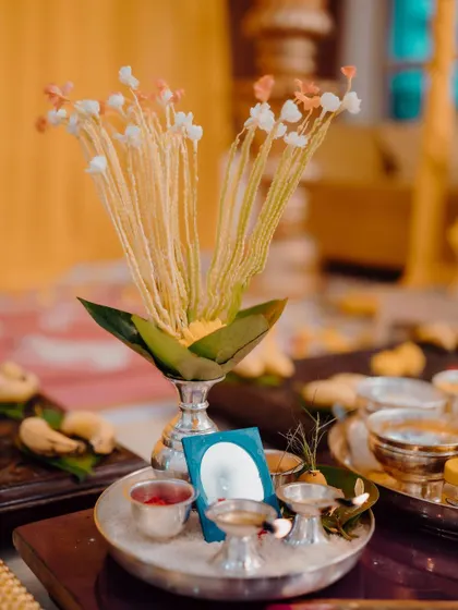 A close-up of the traditional items used in the Haldi pooja. Every element is carefully arranged to be both aesthetically pleasing and true to our customs.