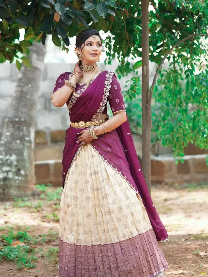 A full-length view of the client in her traditional attire, with the mehendi complementing her overall look.