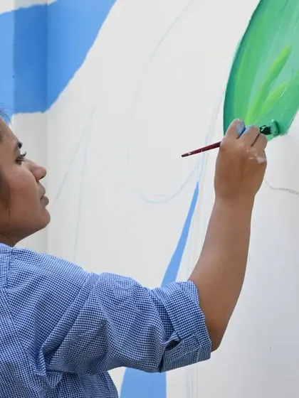 This photo captures me during a painting drive, fully in my element. It reminds me of my 11-year journey to be able to introduce myself as an 'Independent Artist'. I didn't get a degree in art, but life gave me experiences that shape my work every day.