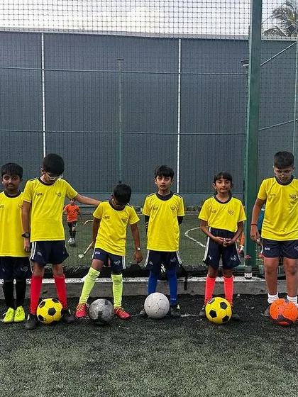 A team photo of our young players, standing proud with their footballs. Each player is an important part of our academy.