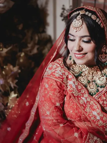 A candid shot of the bride's happy smile during the ceremony, capturing a moment of genuine joy.