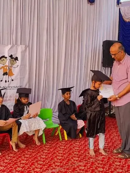 A student receiving her graduation certificate during our 9th Annual Day. It's a proud moment for the children, their parents, and for me as their guide.