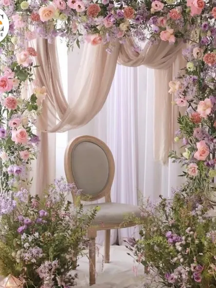 A beautiful pastel floral arch, perfect for a baby shower, engagement, or as a wedding photo booth. The abundance of flowers creates a soft and romantic look.