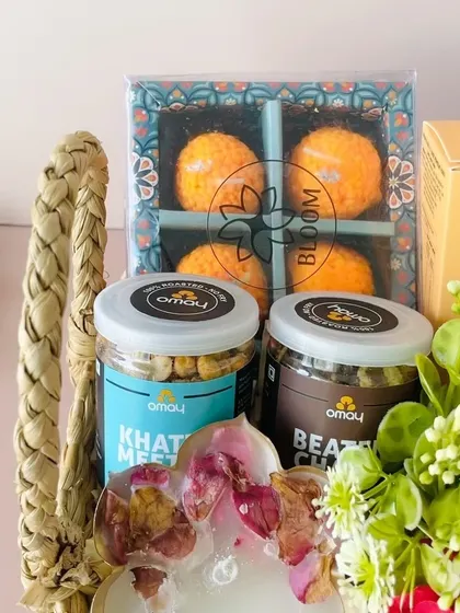 We focus on quality snacks. Here's a close-up of the laddoo candles and jars of healthy roasted snacks from Omay.