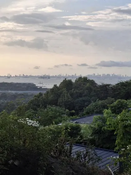 The view from Villa Toshi extends over the lush Alibaug canopy to the Mumbai skyline in the distance. The design of the home and garden is oriented to capture this unique juxtaposition of nature and city.