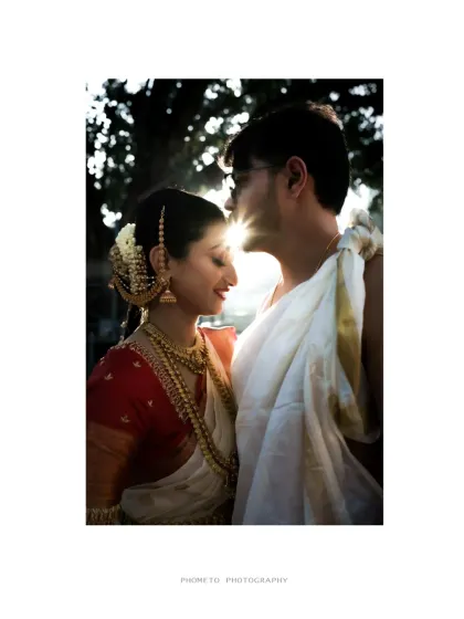 A beautiful silhouette of the couple against the setting sun, a perfectly romantic and artistic wedding portrait.