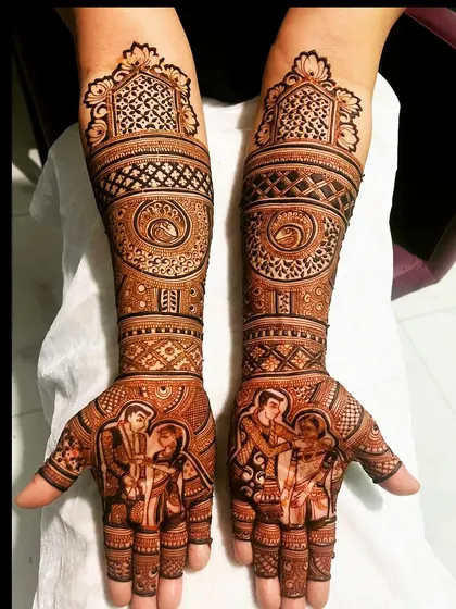 A modern take on bridal mehendi, this design combines a family portrait on the palms with bold geometric patterns and swirls on the forearms.