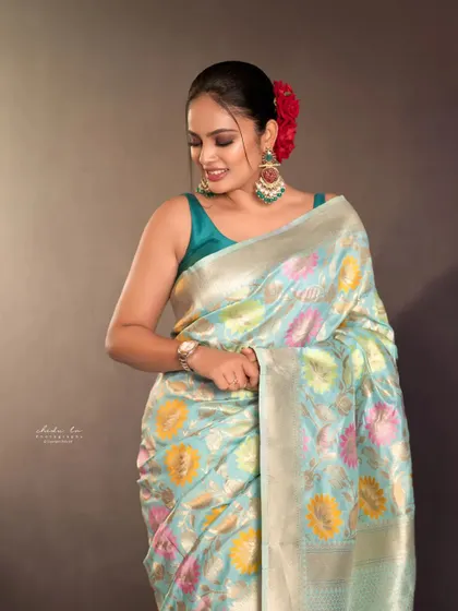 A simple, elegant portrait in a beautiful pastel saree. This shows that beauty can be captured in quiet, understated moments too.