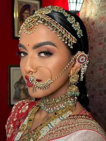 A close-up of a traditional Rajasthani bride. Learn the art of creating authentic, regional bridal looks in my comprehensive masterclass.