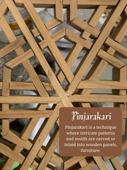 Pinjarakari is a technique of creating intricate lattice patterns from wood. This image shows the complex joinery involved, a craft we use to make beautiful screens and panels.