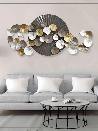 Add a creative and classy vibe to your interior with this abstract metal art. A large central disc is surrounded by a throng of smaller, multi-toned circles, creating a dynamic and visually engaging piece that enriches any room's ambiance.