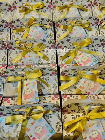 A large order of our floral baby shower return favors, each with a custom tag and ready for the celebration.