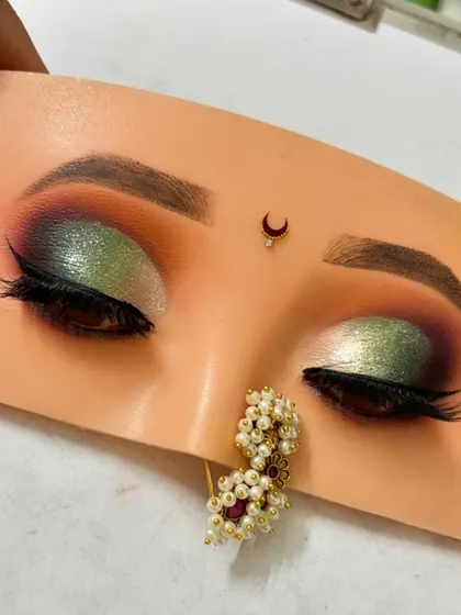 The final green half-cut crease look. I teach how to balance bold colors with dark outer corners to create depth and dimension.