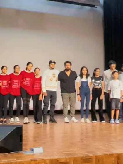 On stage with a group of talented young performers and my fellow judges. Mentoring and encouraging the next generation of artists is a core part of my mission.