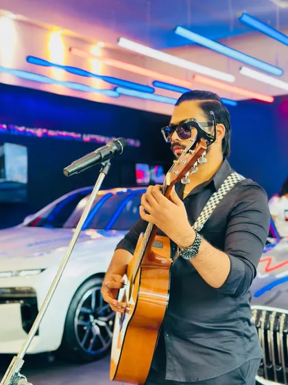 A close-up of my guitar work during the BMW event. I use a specific fingerpicking style for many acoustic songs to create a richer, more intricate sound.