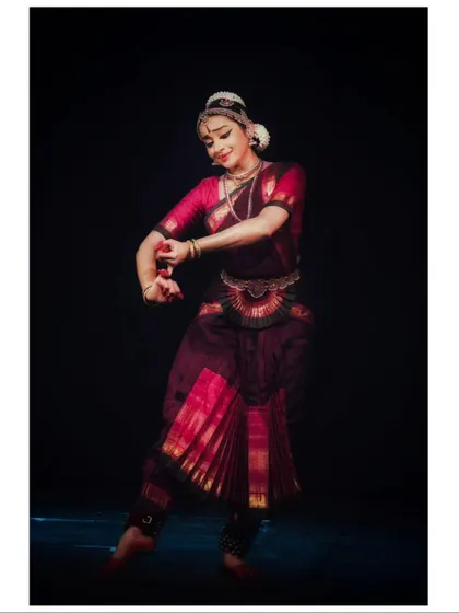 A graceful movement captured mid-turn, showing the fluidity and control of the dance.
