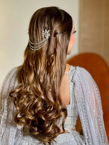 A side view showing how the hair chain drapes beautifully over the soft curls.