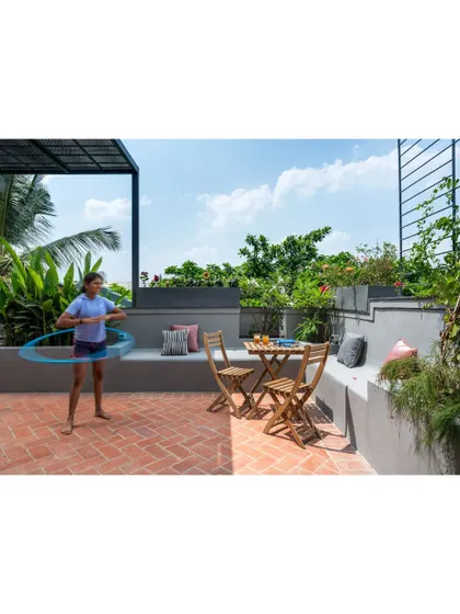 Our daughter enjoying the terrace. It's a versatile space for play, relaxation, and entertaining.