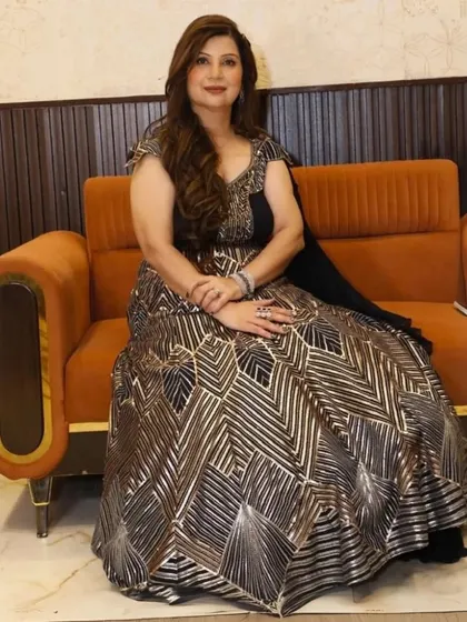 My client looking poised and graceful in a premium black and silver gown. The geometric sequin pattern on the skirt is a unique detail that makes this dress a true work of art.