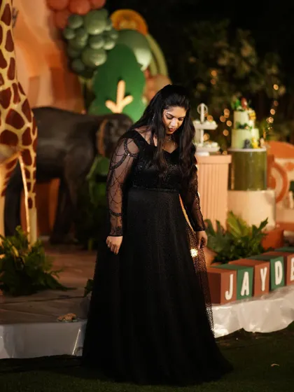 Another view of Supritha's elegant black gown, showing its beautiful drape and fit.