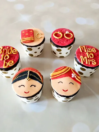 To accompany the engagement ring cushion cake, I created these adorable custom cupcakes. Each one is topped with a fondant design, including a bride and groom, rings, and "Bride to Be" messages.