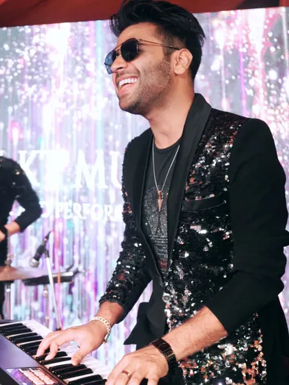 Where words fail, music speaks. A photo of me at the keyboard, smiling and creating music.