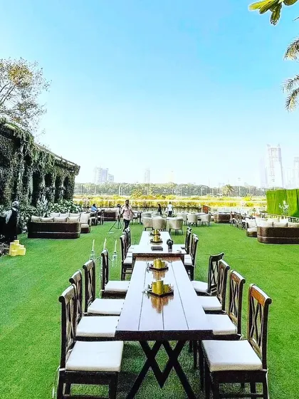 I handle large-scale outdoor events as well. For this lawn party, I installed artificial turf and arranged seating for a large number of guests. My services can cover everything from the ground up to make your outdoor venue ready for any celebration.
