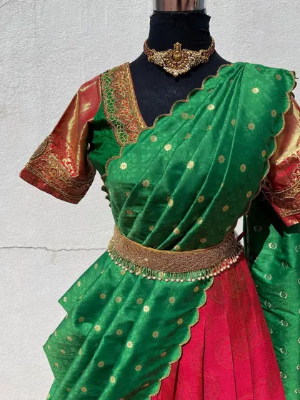A close-up of the blouse and the embellished belt.