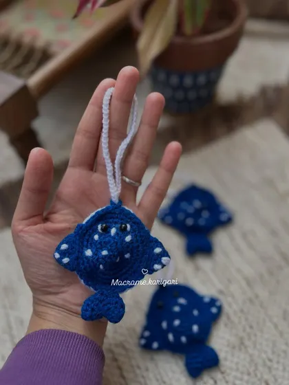 A stingray-themed pouch or charm. This unique design is perfect for ocean lovers and adds a touch of aquatic fun to your accessories.