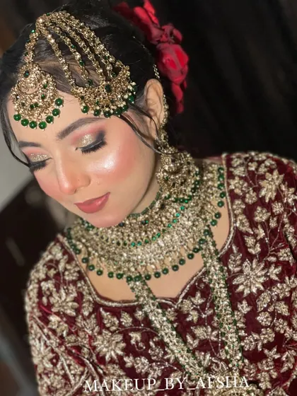 A close-up on the makeup. I used a shimmery eyeshadow to make her eyes pop and a soft lip color that complements the rich tones of her outfit.