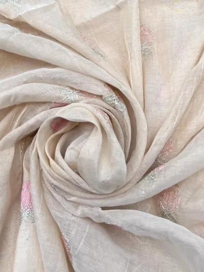This Chanderi tissue fabric with delicate pink and silver embroidery offers a beautiful combination of sheer texture and subtle sparkle.