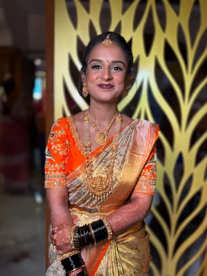 Ready for her forever. This bride's soft smile and elegant posture show her readiness for the big moment, with her makeup and styling perfectly in place.