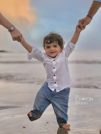 There's nothing like a child's first steps on the sand, held securely by the hands of those who love him most. Our beach photoshoots are all about capturing that sense of freedom, play, and connection against the beautiful backdrop of the Mumbai seaside.
