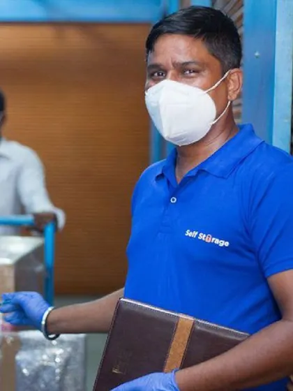 Our professional staff is the backbone of our service. Here, a team member is carefully processing items for storage, showcasing our commitment to security, hygiene, and organized handling of your belongings.