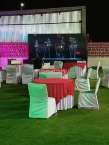 My services extend to outdoor venues for corporate functions and receptions. This setup includes arranged seating on a lawn and a large LED wall for presentations or entertainment, demonstrating my technical production capabilities.