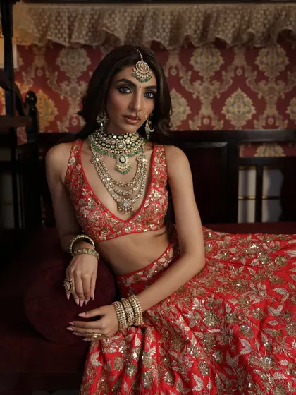 Another shot from this series, focusing on the layered necklaces and the intricate details of the bridal ensemble.