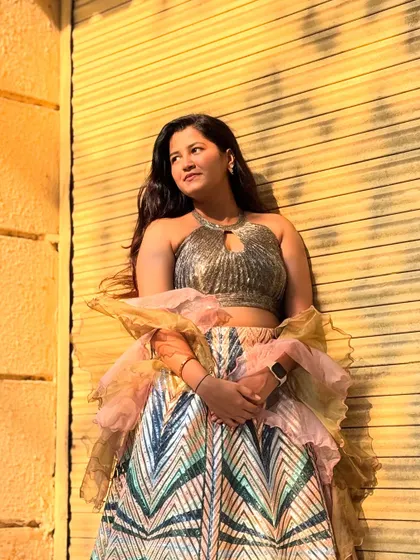 This outfit is all about modern design and fun textures, from the sequin skirt to the multi-layered ruffled dupatta.
