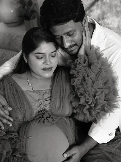 This black and white maternity photo emphasizes the emotion and connection between the couple, creating a timeless and artistic portrait.