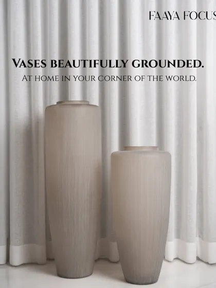 A different perspective on our fluted glass vases, emphasizing their height and graceful silhouette. They are designed to bring a sense of calm grandeur to any space they inhabit.