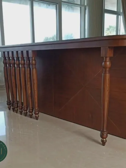 A classic wooden console table with multiple turned legs, designed as a sofa back table. The intricate woodwork and rich finish add a touch of traditional elegance.