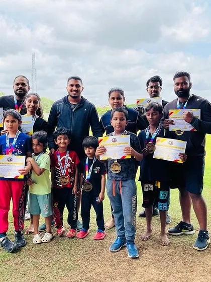 A group of our decorated youth fighters and coaches. Each medal and certificate represents countless hours of training and dedication.