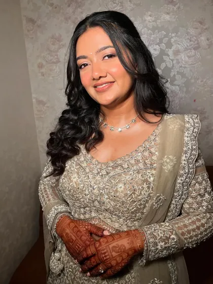 A beautiful portrait showing the minimal yet glowing makeup. The focus is on enhancing her natural beauty and creating a look that feels elevated and fresh.