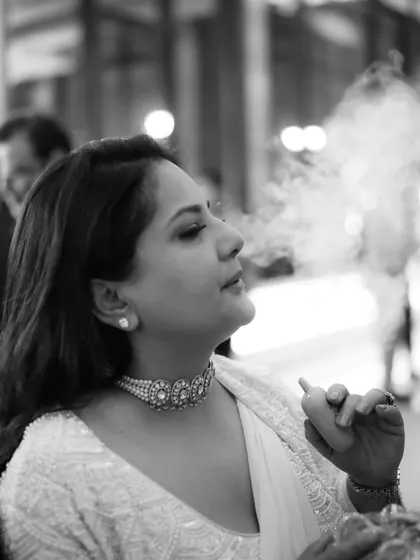 A stylish, candid moment at a cocktail party. This black and white shot has a classic, reportage feel to it.
