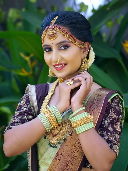A joyful bride with a bright smile. The makeup is designed to be radiant and picture-perfect from every angle, complementing her happy expression.